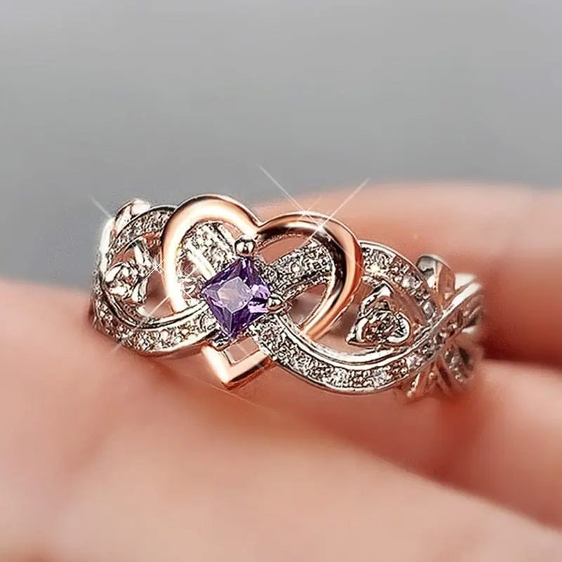 Huitan women's heart ring with romantic rose flower design and cubic zirconia accent, ideal for wedding or engagement jewelry.