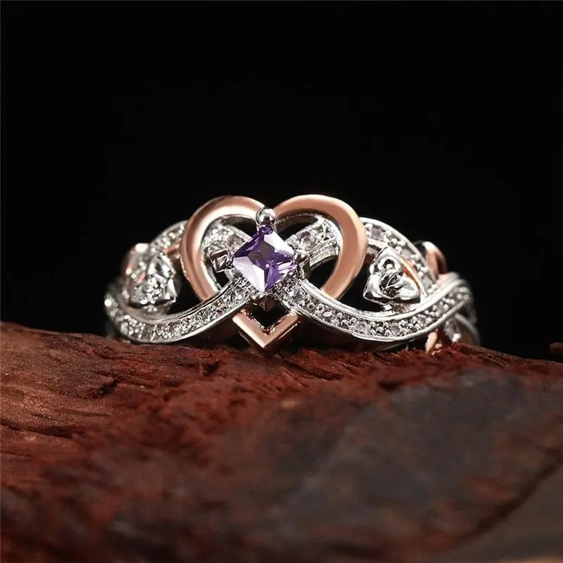Huitan women's heart ring with romantic rose flower design and cubic zirconia accents, ideal as a wedding or engagement band.