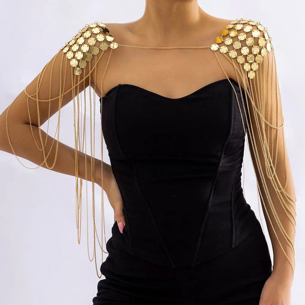 Gold metal chain shoulder body harness with sequins, featuring tassels and punk-inspired design for women.