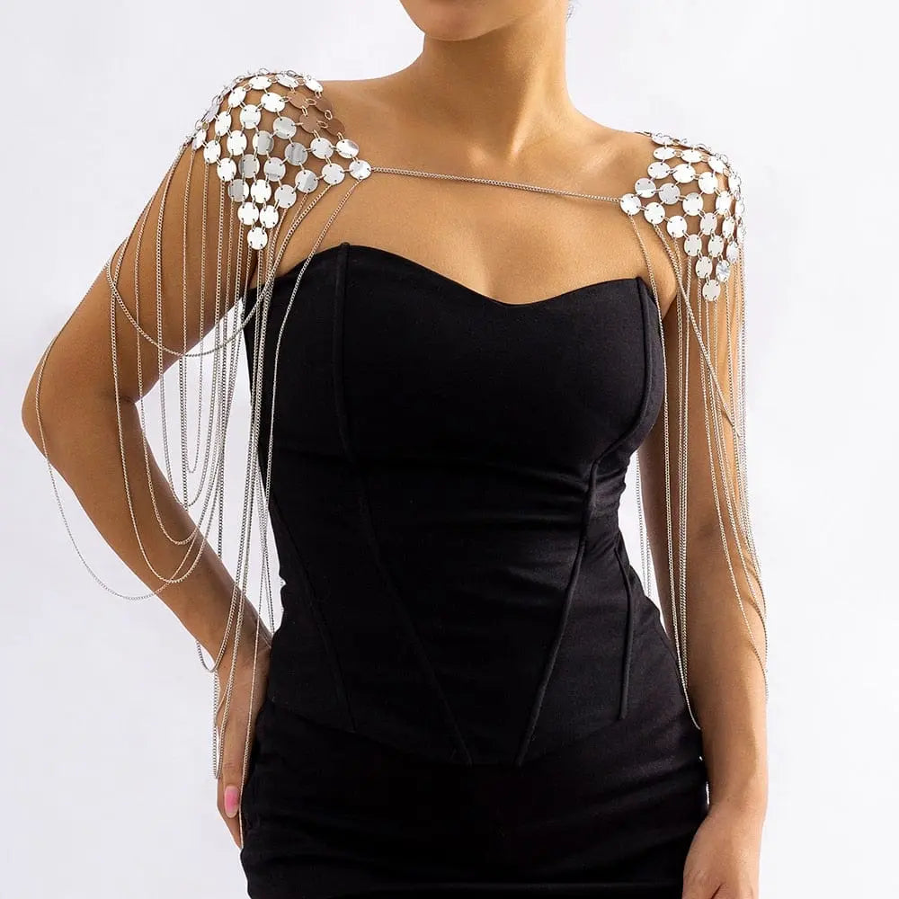 Gold metal chain shoulder body harness with sequin details, designed for women, featuring punk-inspired tassel and epaulette style.
