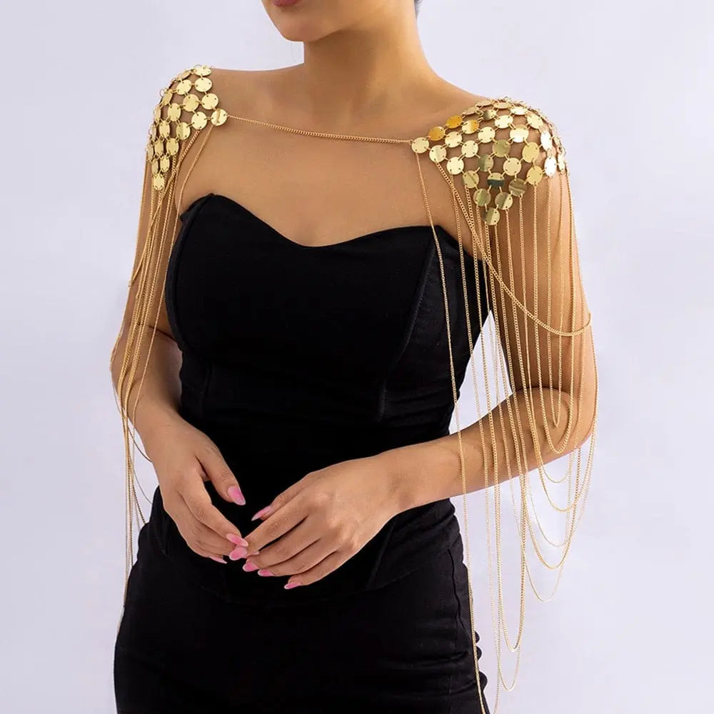 Gold metal chain shoulder body harness with sequins, tassels, and punk-inspired design for women.