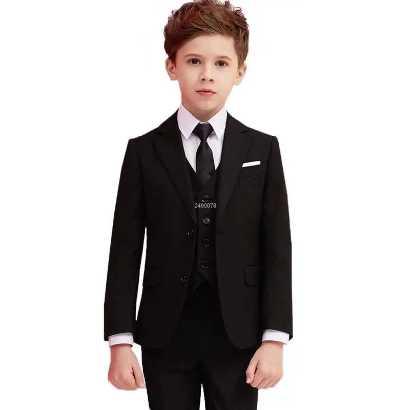 Navy blue boys’ wedding suit by Showlu Fashion Store featuring a 3-piece cotton slim fit blazer set for special occasions.