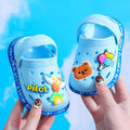 Kids cartoon hole sandals from Showlu Fashion Store, soft anti-skid EVA beach shoes for boys and girls, featuring fun colorful designs.