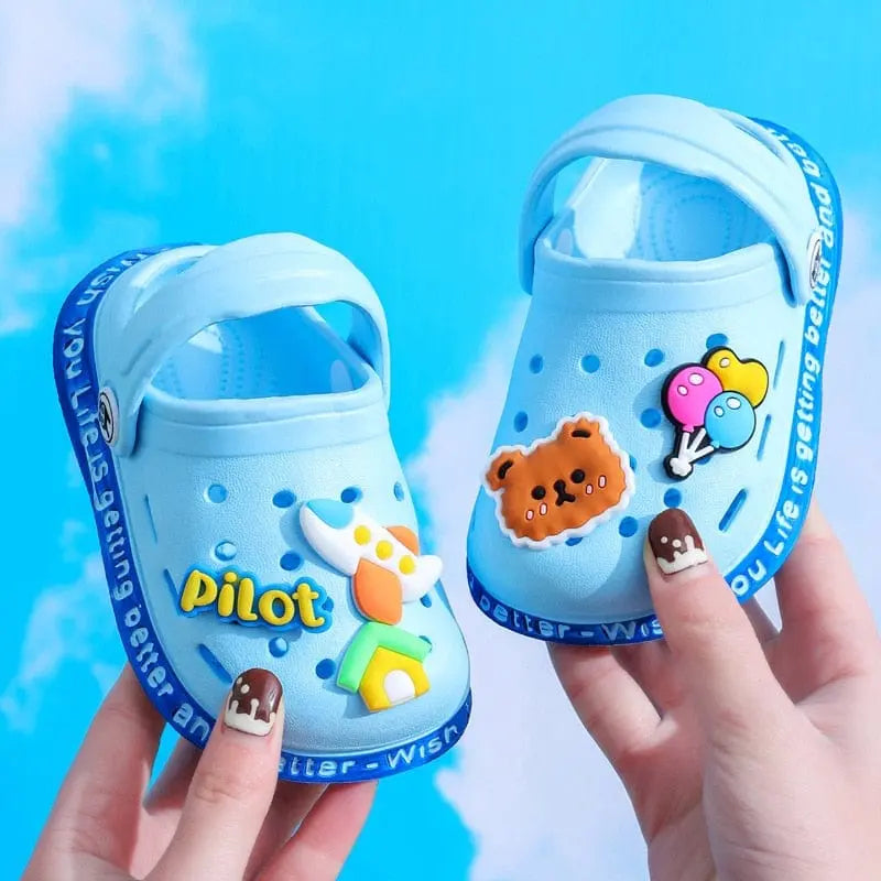 Kids cartoon hole sandals from Showlu Fashion Store, soft anti-skid EVA beach shoes for boys and girls, featuring fun colorful designs.