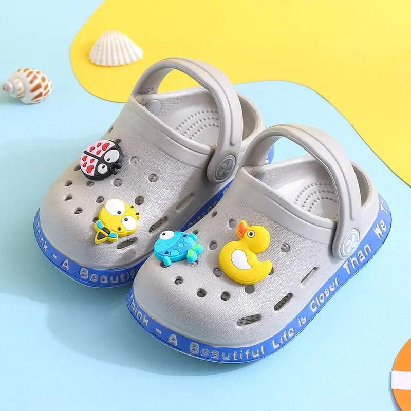 Kids cartoon hole sandals by Showlu Fashion Store, soft anti-skid EVA beach shoes for boys and girls with fun design.