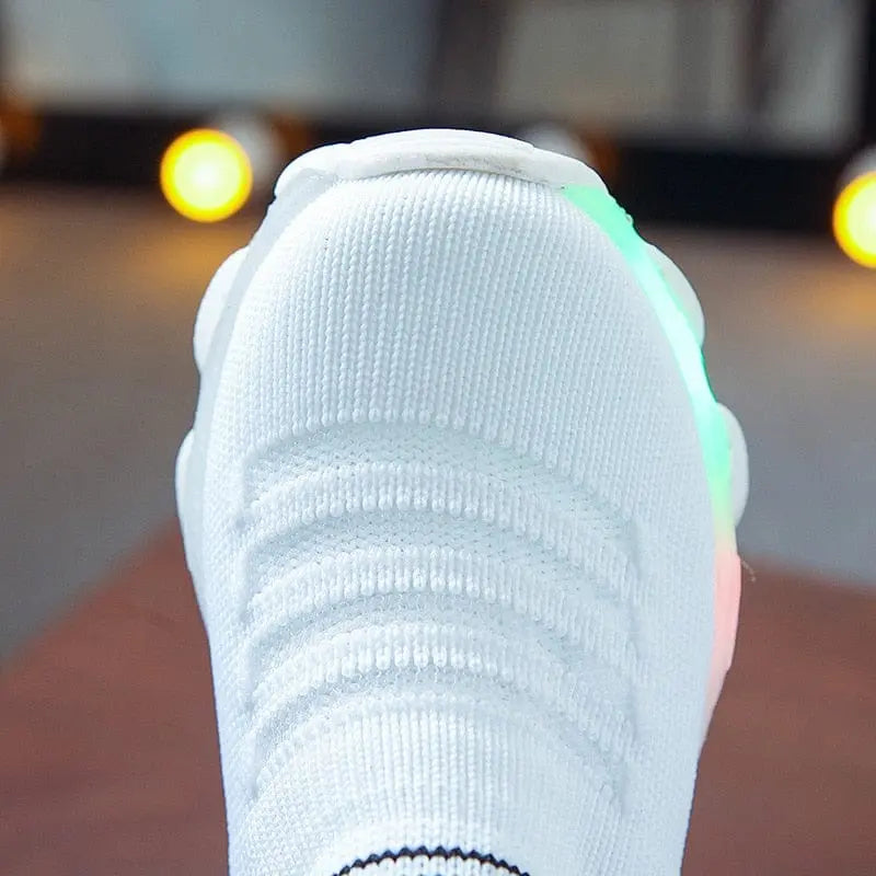 Kids LED light-up sneakers with mesh slip-on design, luminous sport shoes for boys and girls, casual and playful footwear.