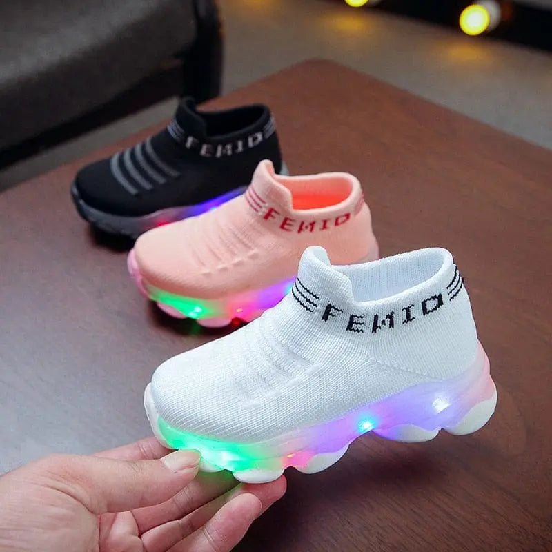 Kids LED light-up sneakers by Showlu Fashion Store, mesh slip-on sport shoes for children with luminous soles and playful design.