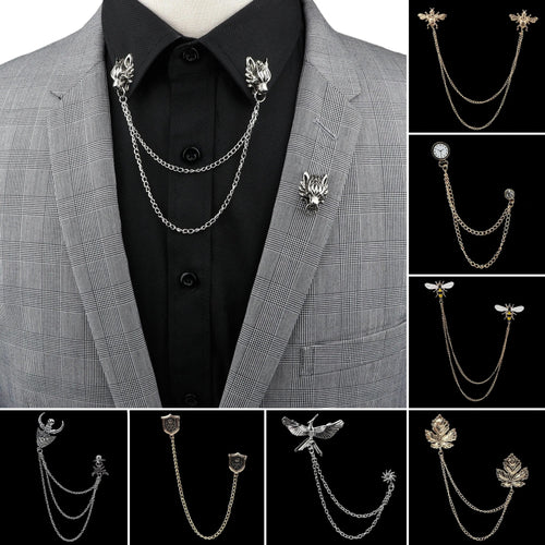 Anel Demosthene Dragon lapel pin with retro tassel chain on a suit jacket, featuring a detailed dragon badge for formal accessories.