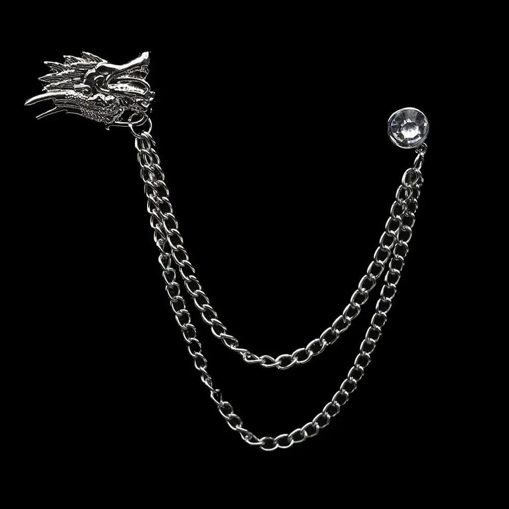 Anel Demosthene Dragon lapel pin with retro tassel chain, worn on a suit collar for wedding or party accessories.