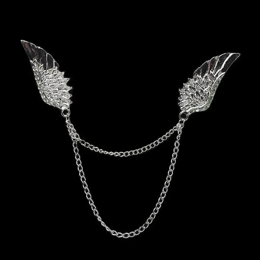 Anel Demosthene Dragon lapel pin with retro tassel chain, worn on a suit collar as a stylish brooch accessory.