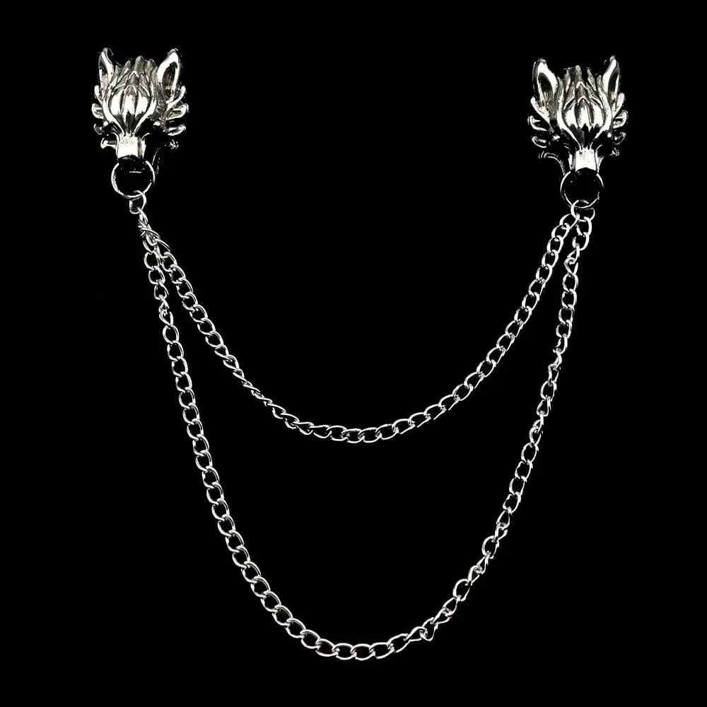 Anel Demosthene dragon lapel pin with retro tassel chain, worn on a suit lapel for wedding or party accessories.