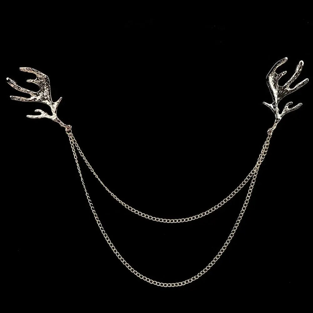 Anel Demosthene Dragon lapel pin with retro tassel chain, worn on a suit collar as a stylish brooch accessory.