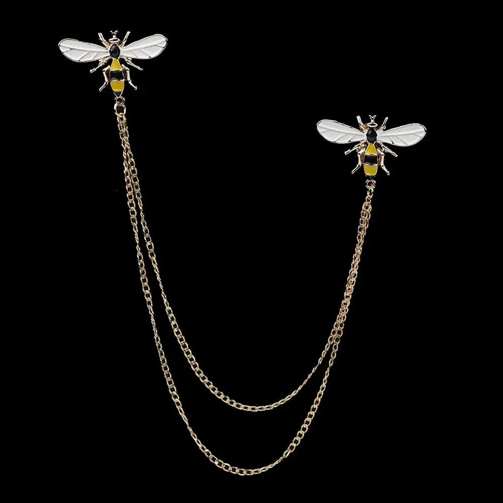 Anel Demosthene Dragon lapel pin with retro tassel chain on a suit collar, stylish men's dress accessory for weddings and parties.