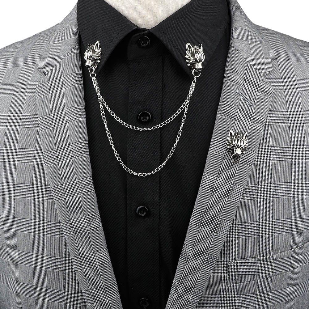 Anel Demosthene Dragon Lapel Pin on a suit collar, featuring a retro tassel chain brooch with dragon design for formal or party wear.