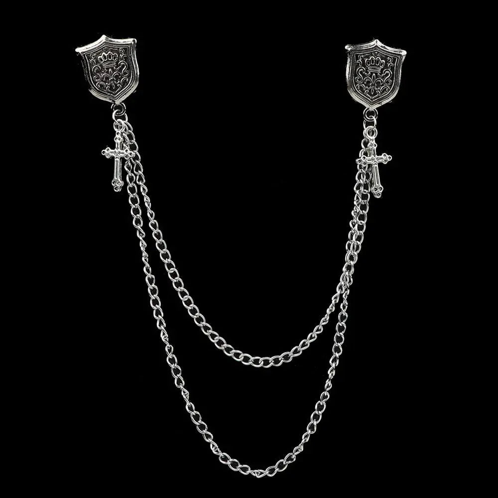 Anel Demosthene Dragon lapel pin with retro tassel chain, worn on a suit blazer lapel, stylish accessory for formal attire.