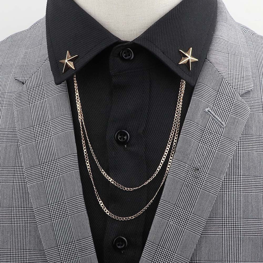 Anel Demosthene Dragon lapel pin with retro tassel chain, worn on man’s suit lapel for a stylish dress or party accessory.