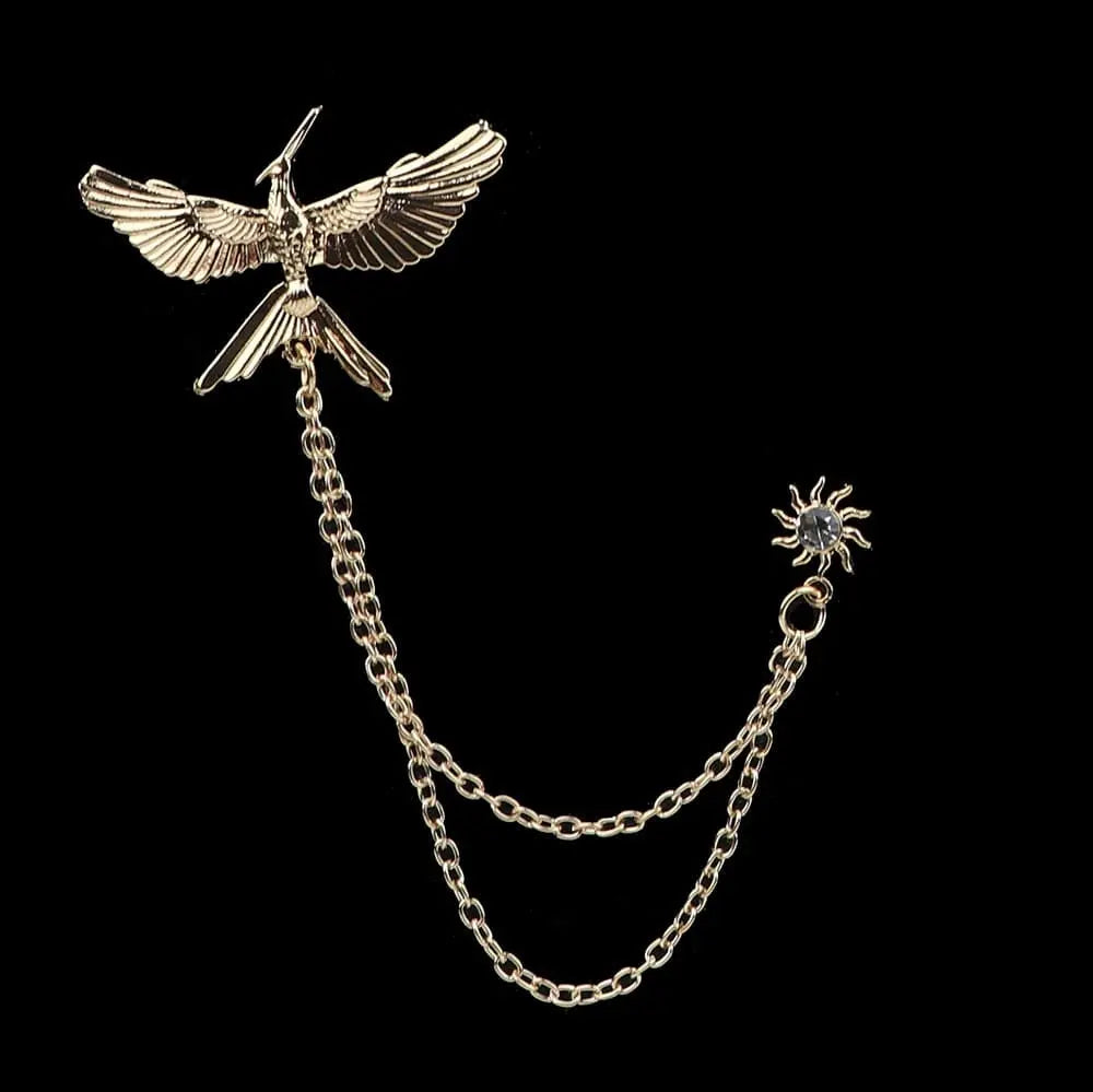 Anel Demosthene Dragon Lapel Pin on a man's suit collar, featuring a retro tassel chain and intricate dragon design for wedding or party wear.
