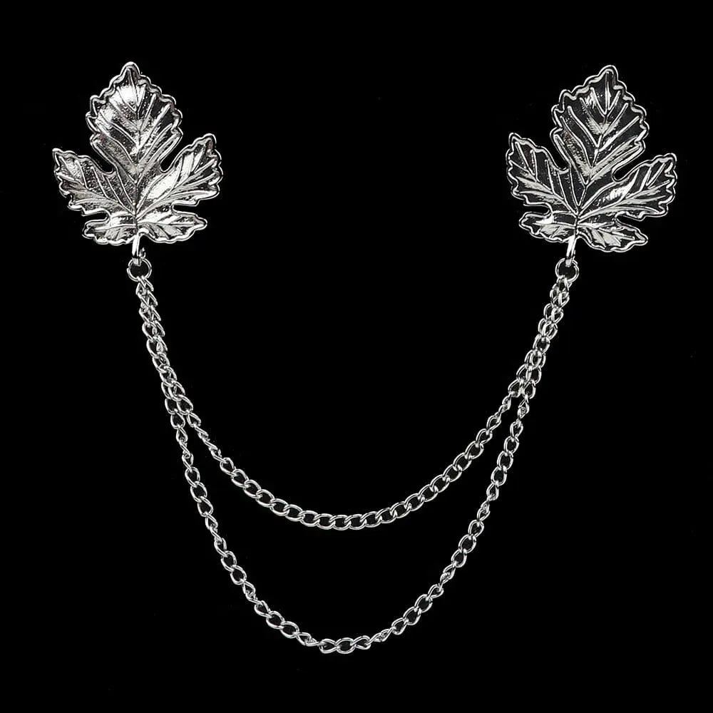 Anel Demosthene Dragon lapel pin with retro tassel chain on a suit collar, stylish brooch accessory for formal or party wear.