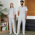 Unisex SIBAIZHI scrub set by Showlu Fashion, soft hospital nurse uniform with pockets, in a professional medical uniform style.