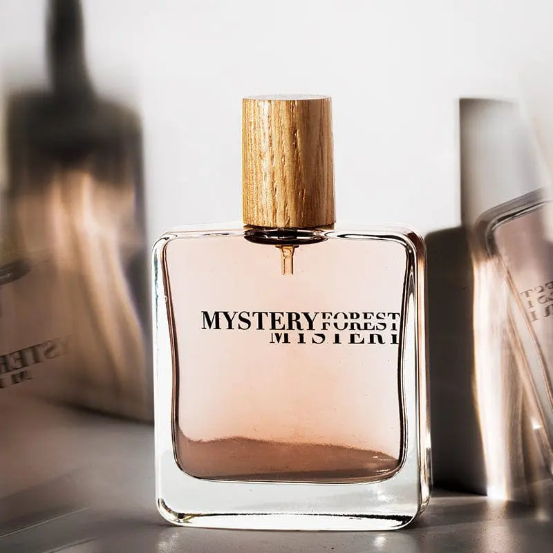 Mystery Forest Fresh Incense perfume bottle, unisex long-lasting fragrance with botanical scent, shown in close-up image.
