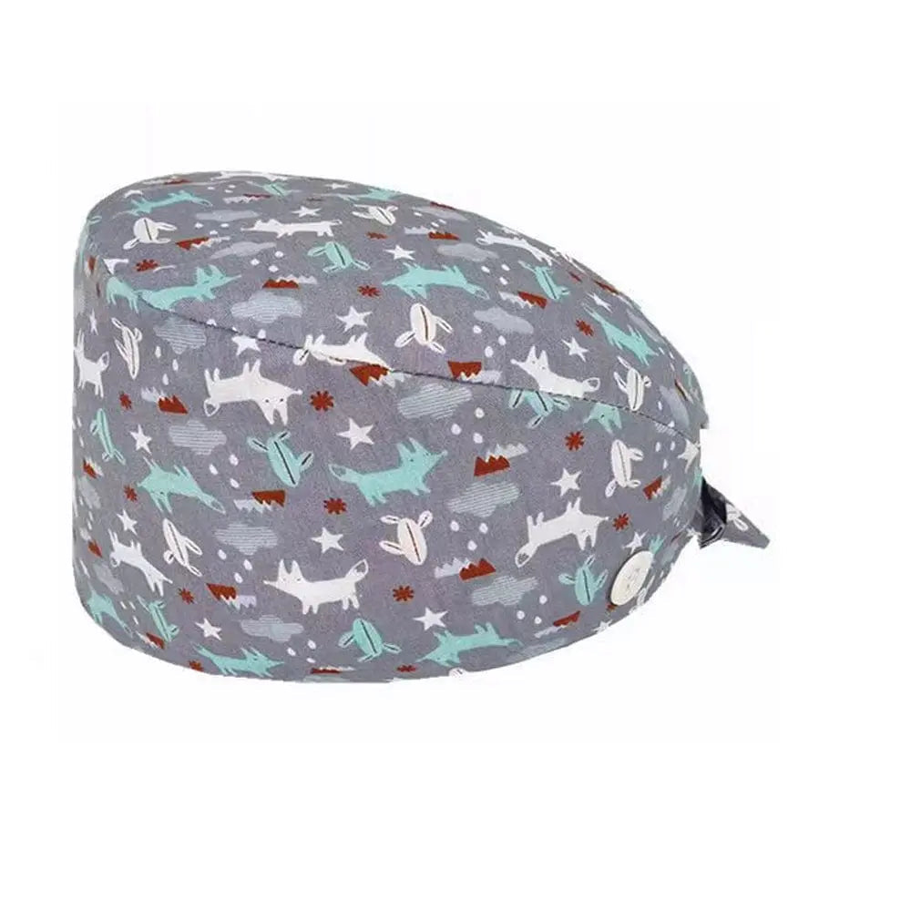 Unisex cotton scrub cap with adjustable fit, buttons, and hospital print, worn by nurse or doctor in medical setting.