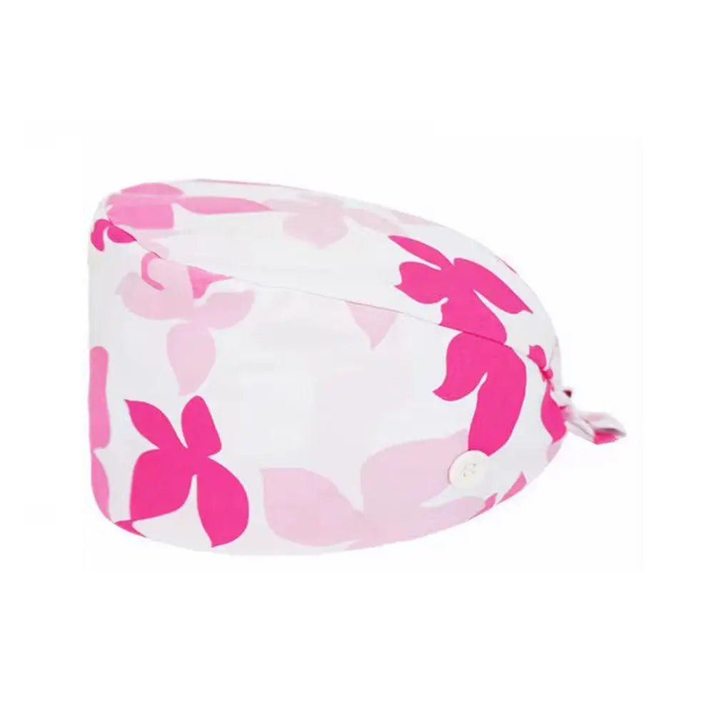 Unisex cotton scrub cap with adjustable fit and buttons, worn by nurse or doctor in hospital settings, featuring colorful print design.