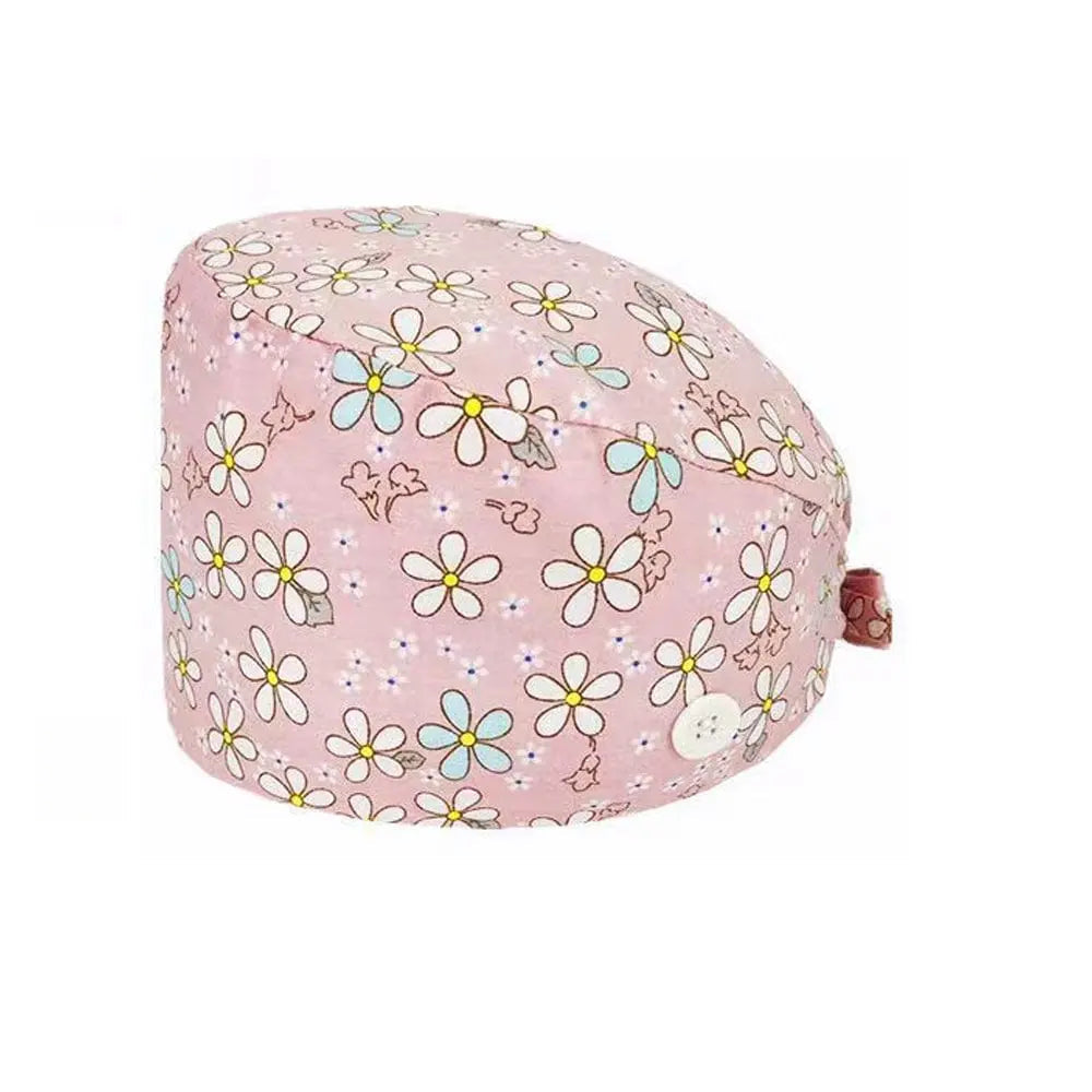 Unisex cotton scrub cap with adjustable fit and buttons, worn by nurses and doctors in hospital settings, featuring a printed design.