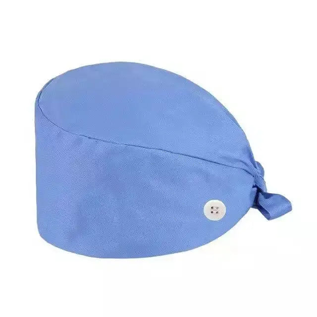 Unisex cotton scrub cap with adjustable fit and button detail, ideal for nurses and doctors in medical settings.