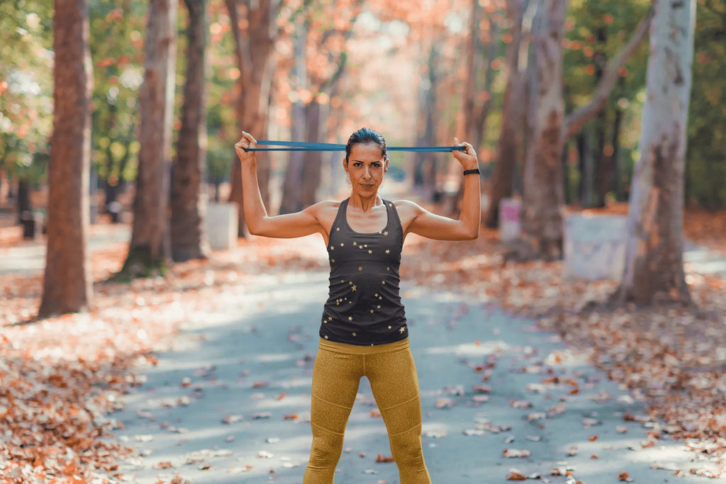Lavender Millie navy gold star tank top for women, stretchy microfiber shirt with a sleeveless design and star pattern.