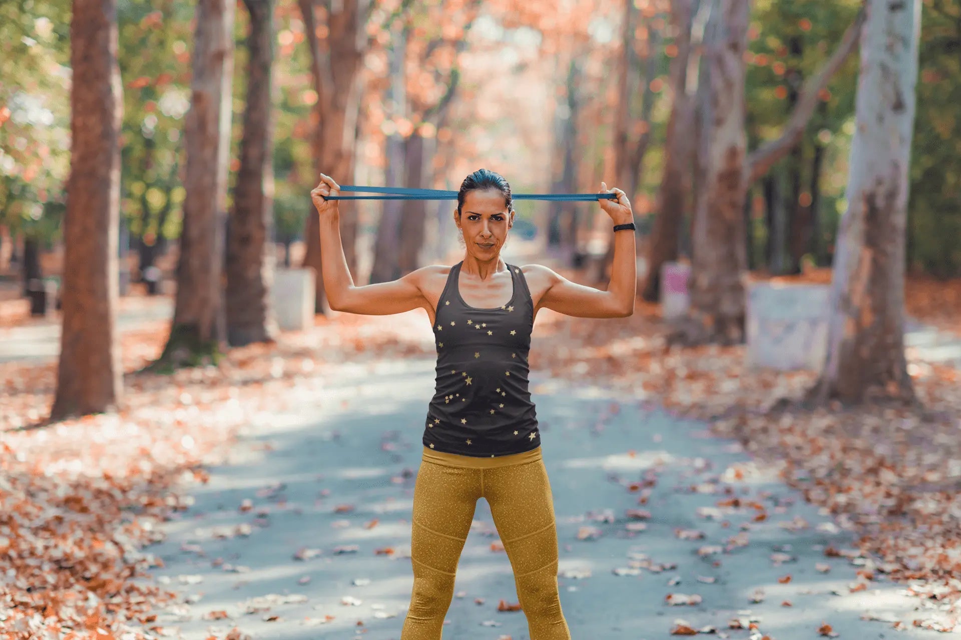 Lavender Millie navy gold star tank top for women, stretchy microfiber shirt with a sleeveless design and star pattern.