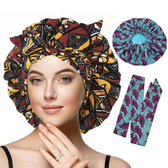 A woman wears the New African Ankara Pattern Satin Lined Bonnet with long ribbon headwrap. Next to her are a matching bonnet and two vibrant blue and pink ribbon strips, all featuring stylish double-layer African patterns.
