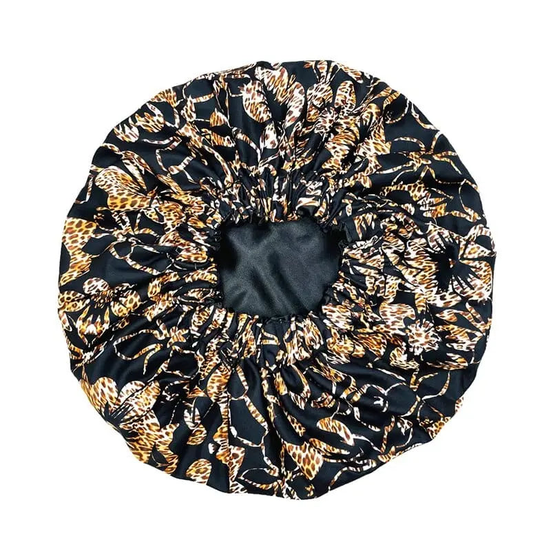 African Ankara satin-lined bonnet with long ribbons and headwrap design, perfect for women’s hair covering and stylish headscarf.