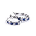 Showlu Fashion sterling silver round CZ zircon stud earrings for women, featuring clear mosaic stones and a sleek circular design.
