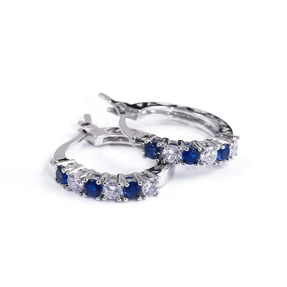 Showlu Fashion sterling silver round CZ zircon stud earrings for women, featuring clear mosaic stones and a sleek circular design.