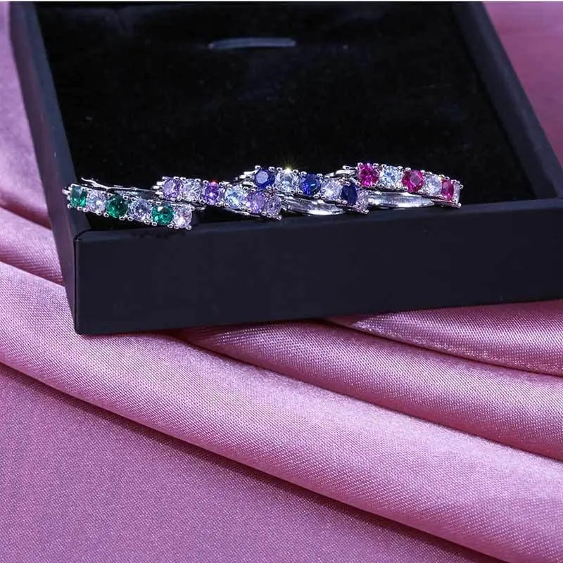 Sterling silver round CZ zircon stud earrings for women with clear mosaic stones, showcasing elegant jewelry design.