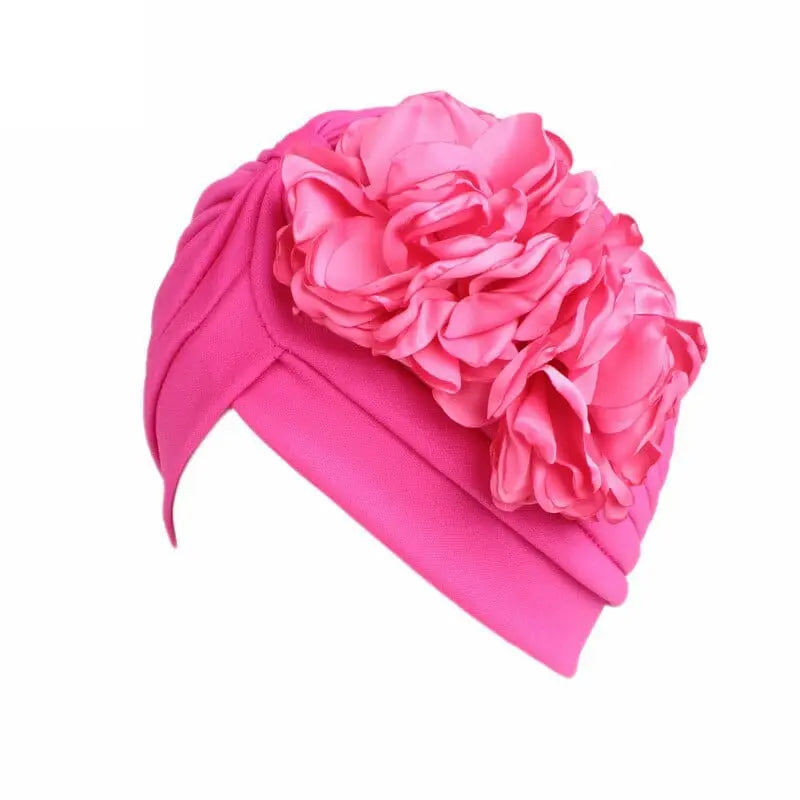Solid color flower-decorated turban head wrap for women, stylish hair accessory and headwear by Showlu Fashion Store.