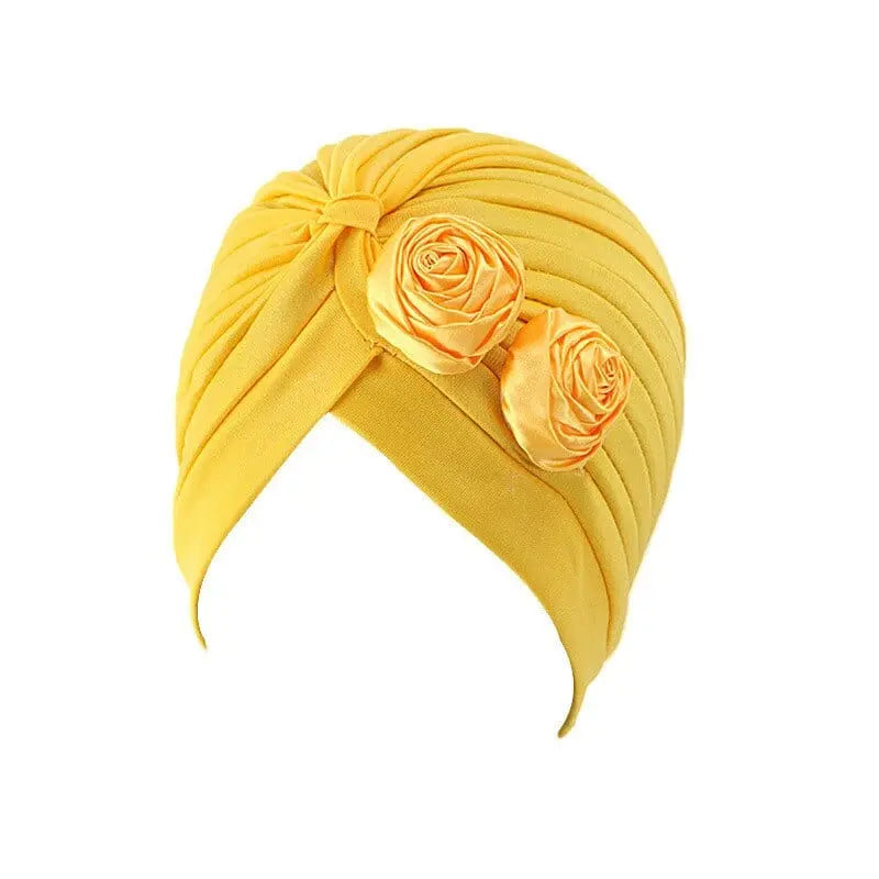 Solid color flower-decorated turban head wrap for women, stylish hair accessory and fashion headwear by Showlu Fashion Store.