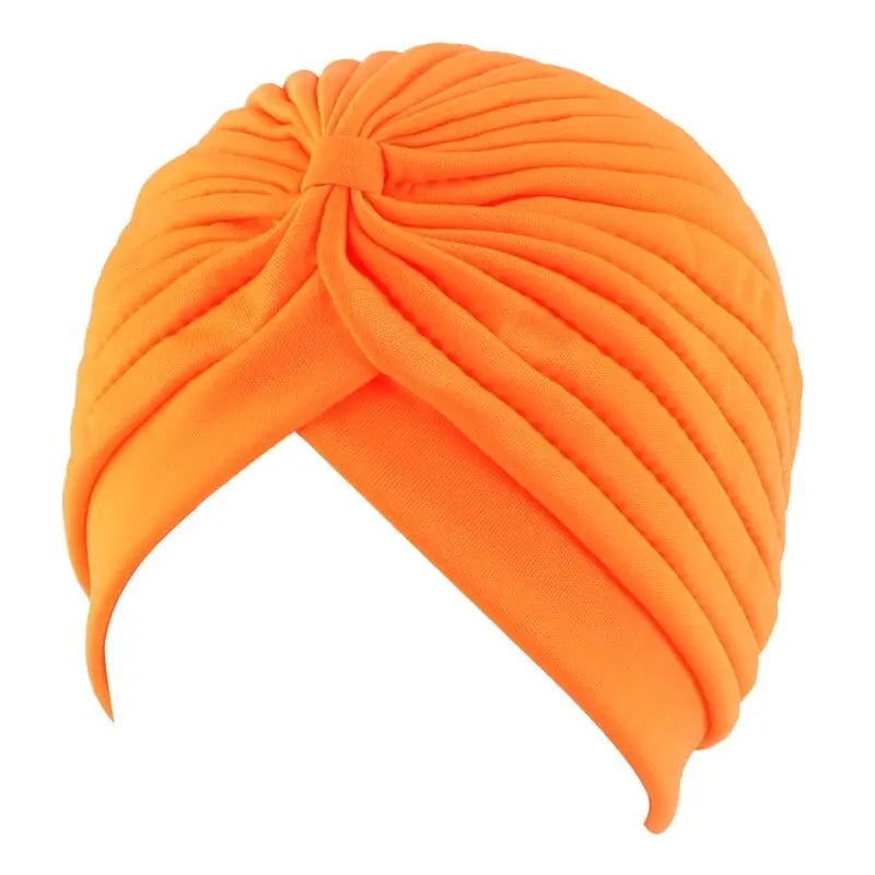 Solid color flower-decorated turban head wrap for women, stylish fashion hair accessory by Showlu Fashion Store.