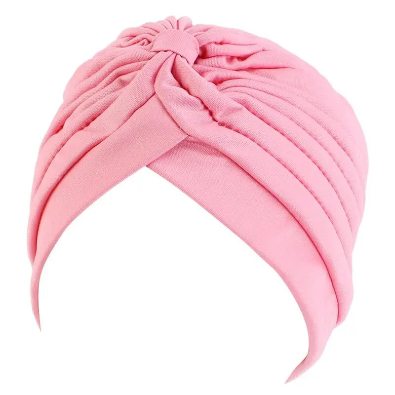 Solid color flower-decorated turban head wrap for women, stylish hair accessory and headwear by Showlu Fashion Store.