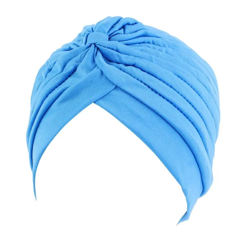 Solid color flower-decorated turban head wrap for women, stylish hair accessory and headwear by Showlu Fashion Store.