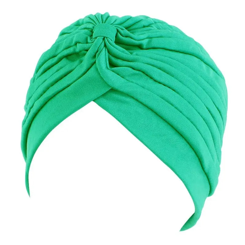 Solid color flower-embellished turban head wrap for women, stylish hair accessory and fashion headwear from Showlu Fashion Store.