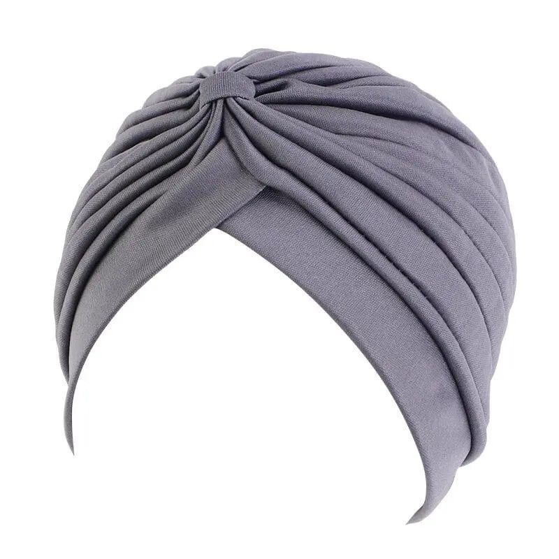 Solid color flower-decorated turban head wrap for women, stylish hair accessory and headwear by Showlu Fashion Store.