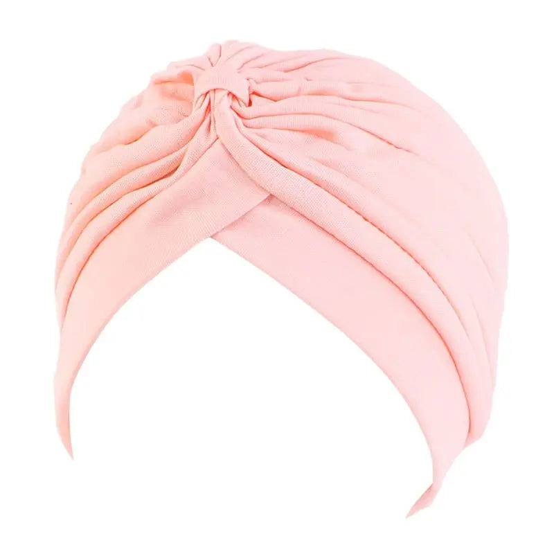 Solid color flower-embellished turban head wrap for women, stylish hair accessory and fashion headwear by Showlu Fashion Store.