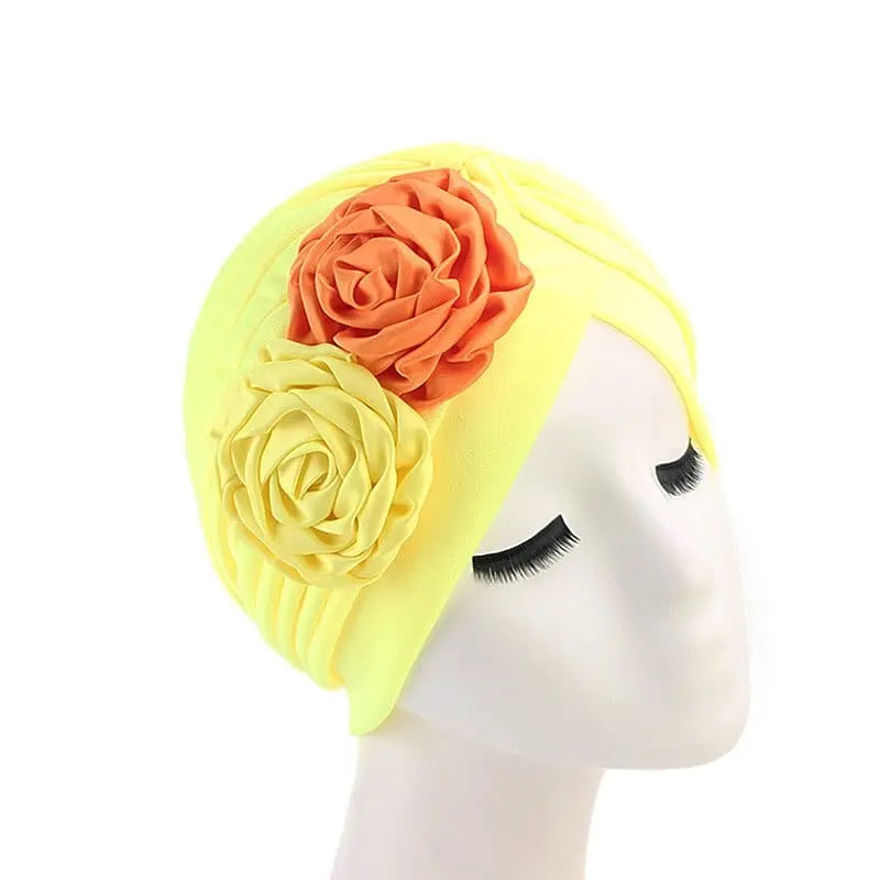 Solid color flower-decorated turban head wrap for women, stylish hair accessory and headwear by Showlu Fashion Store.