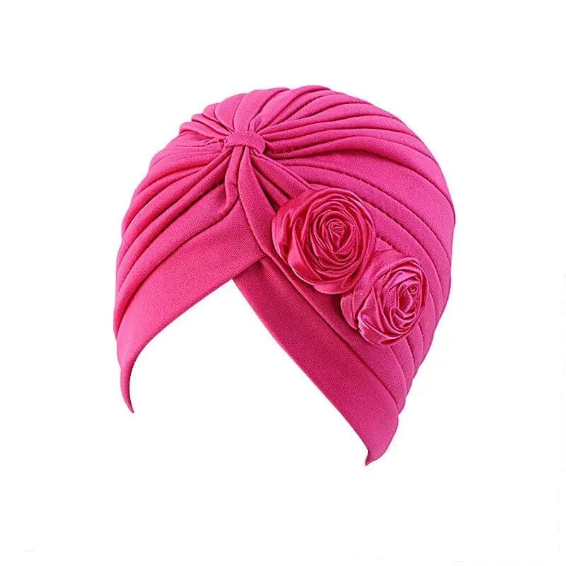 Solid color flower-decorated turban head wrap for women, stylish hair accessory and headwear by Showlu Fashion Store.