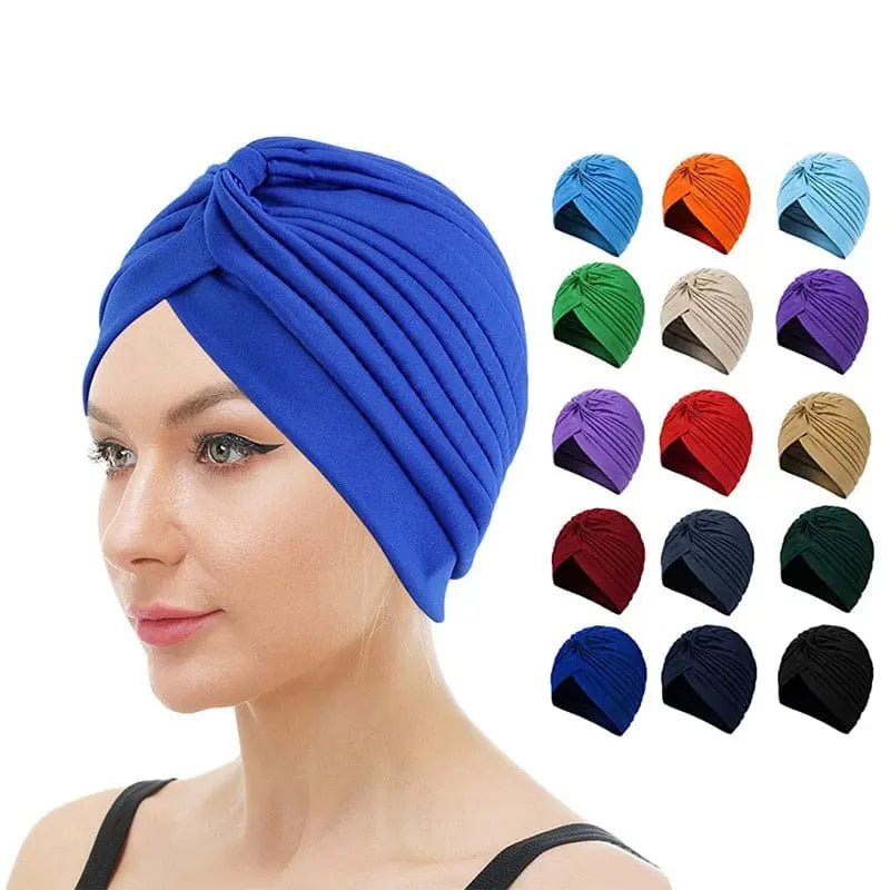 Stretchy women's turban cap with twisted pleats in assorted colors, designed as a chemo beanie and hair cover by Showlu Fashion.
