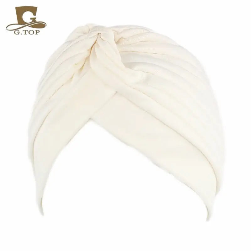 Stretchy women’s twisted pleated turban cap in assorted colors, chemo beanie hat with comfortable hair cover for women and girls.
