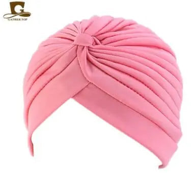 Stretchy women's turban cap with twisted pleated design in assorted colors, ideal for hair coverage and stylish headwear.