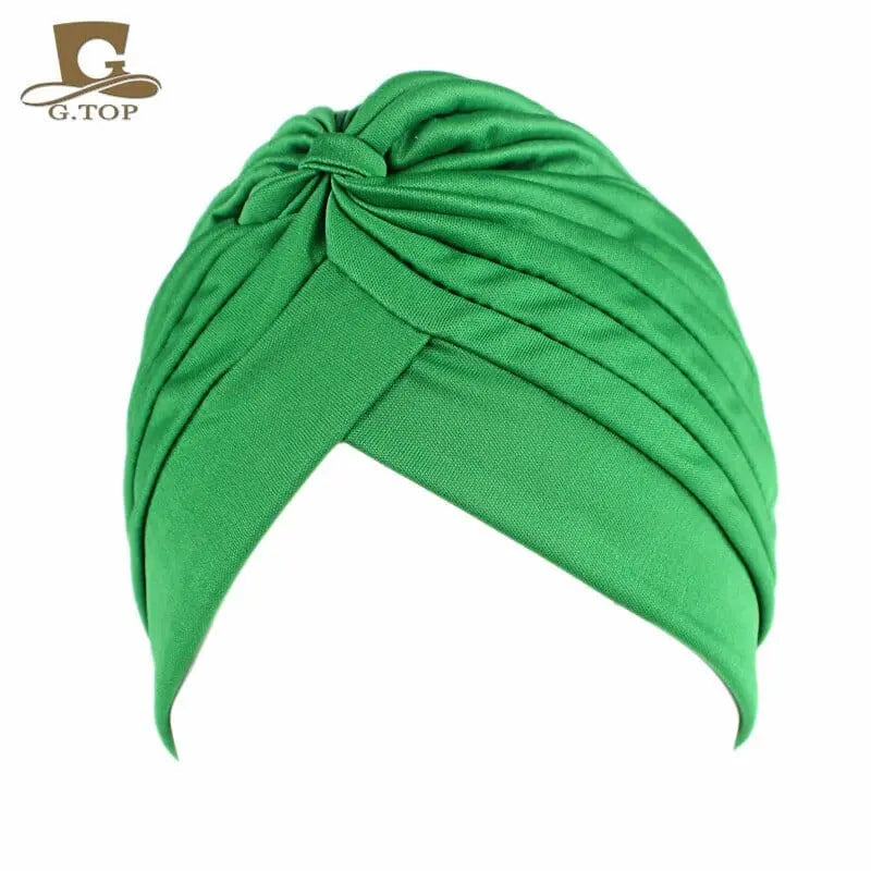 Stretchy women's turban cap by Showlu Fashion with twisted pleated design, available in assorted colors, ideal for hair coverage.