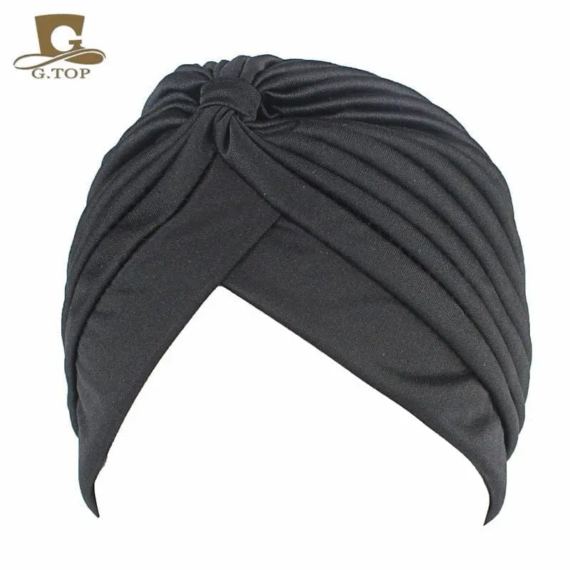 Women's stretchy twisted pleated turban cap in assorted colors, stylish hair cover and chemo beanie by Showlu Fashion Store.